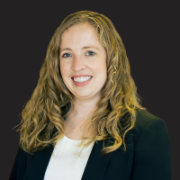 A headshot photograph of Emma Bijesse.